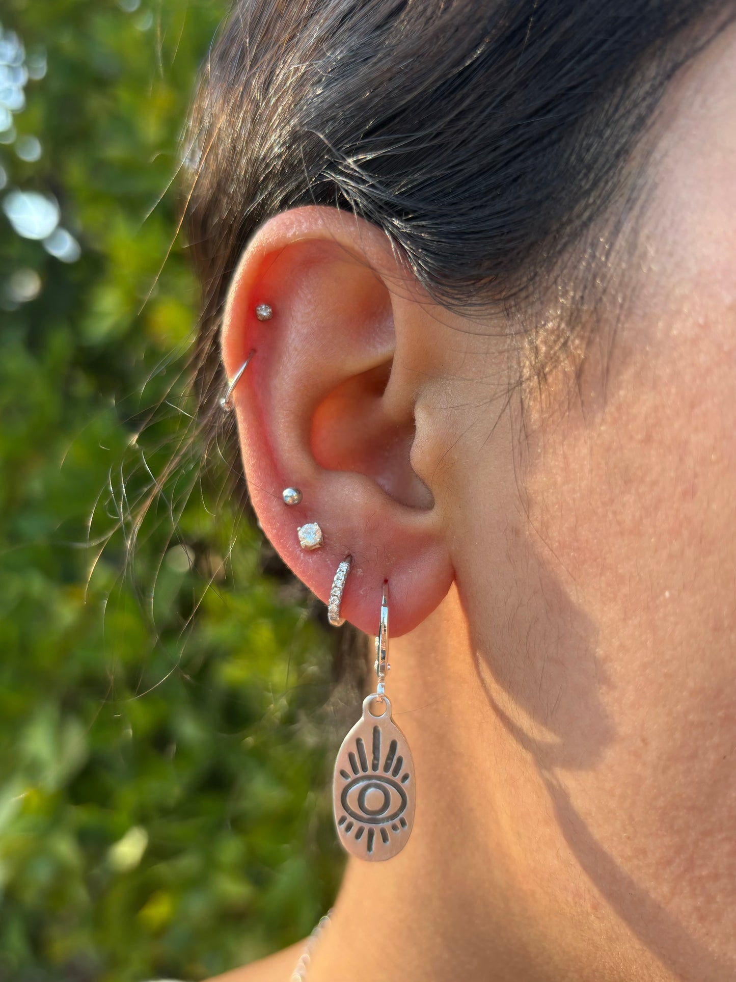 Oval Eye Silver Huggie Earrings