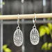 Oval Eye Silver Huggie Earrings